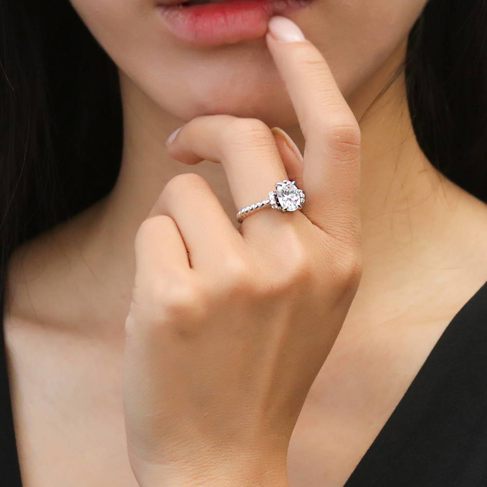 Model wearing Woven Solitaire CZ Ring in Sterling Silver