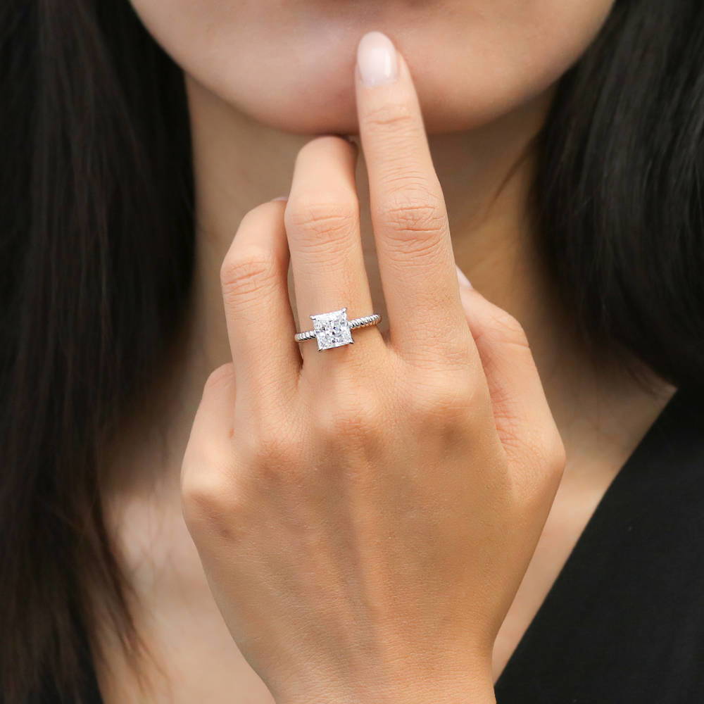 Model wearing Woven Solitaire CZ Ring in Sterling Silver