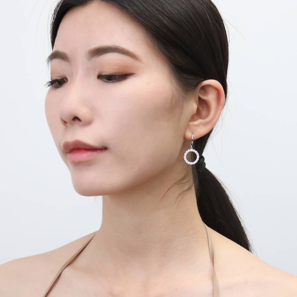 Model wearing Open Circle CZ Fish Hook Dangle Earrings in Sterling Silver