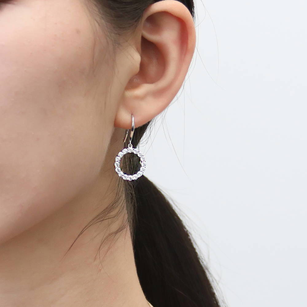 Model wearing Open Circle CZ Fish Hook Dangle Earrings in Sterling Silver