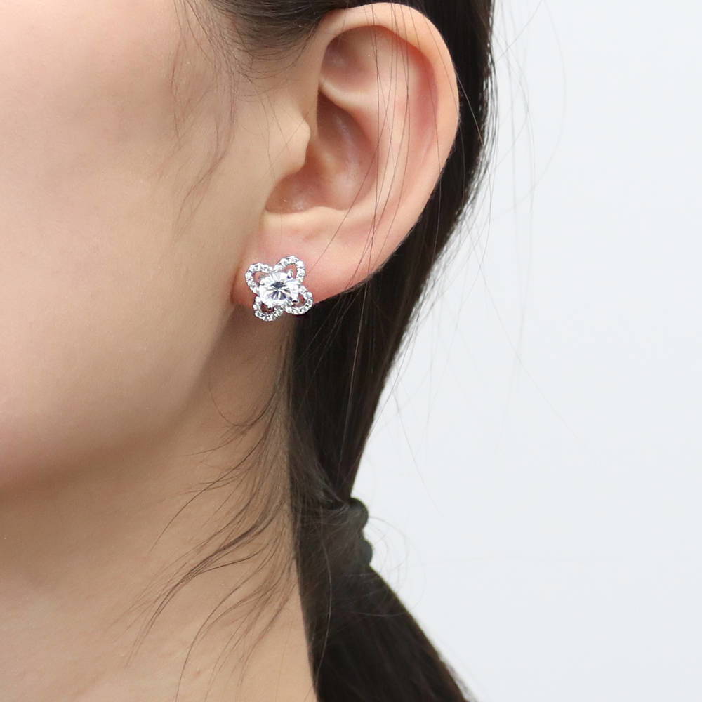 Model wearing Flower Halo CZ Stud Earrings in Sterling Silver