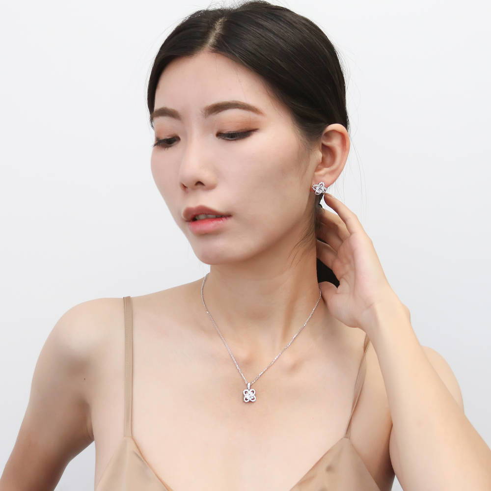 Model wearing Flower Halo CZ Stud Earrings in Sterling Silver