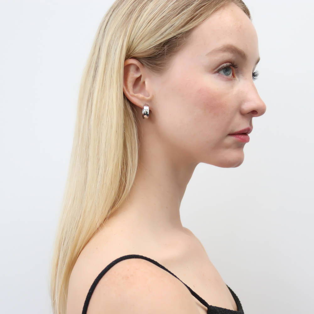 Model wearing Dome Medium Hoop Earrings in Sterling Silver 0.66 inch