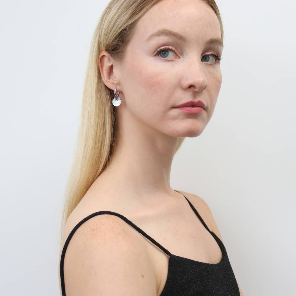 Model wearing Lock Mother Of Pearl Dangle Earrings in Sterling Silver