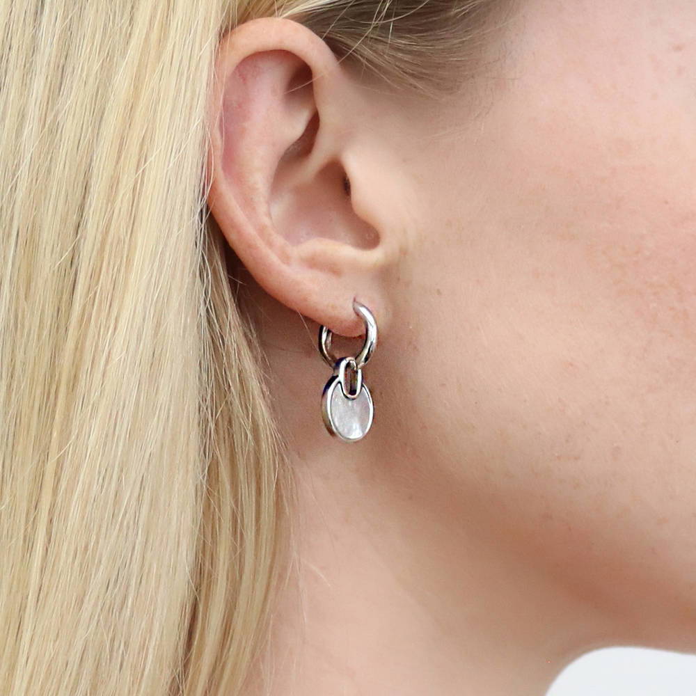 Model wearing Lock Mother Of Pearl Dangle Earrings in Sterling Silver