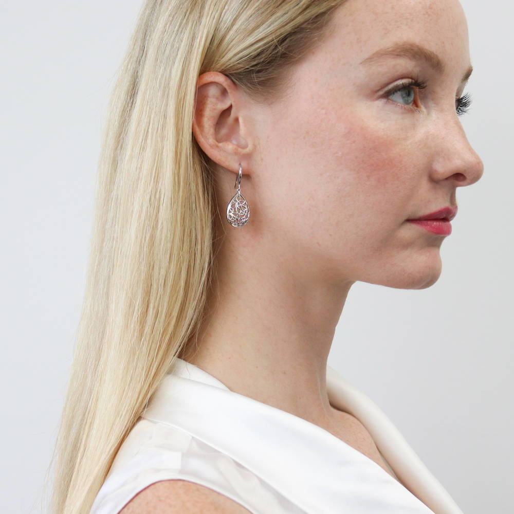 Model wearing Butterfly Teardrop Fish Hook Dangle Earrings in Sterling Silver