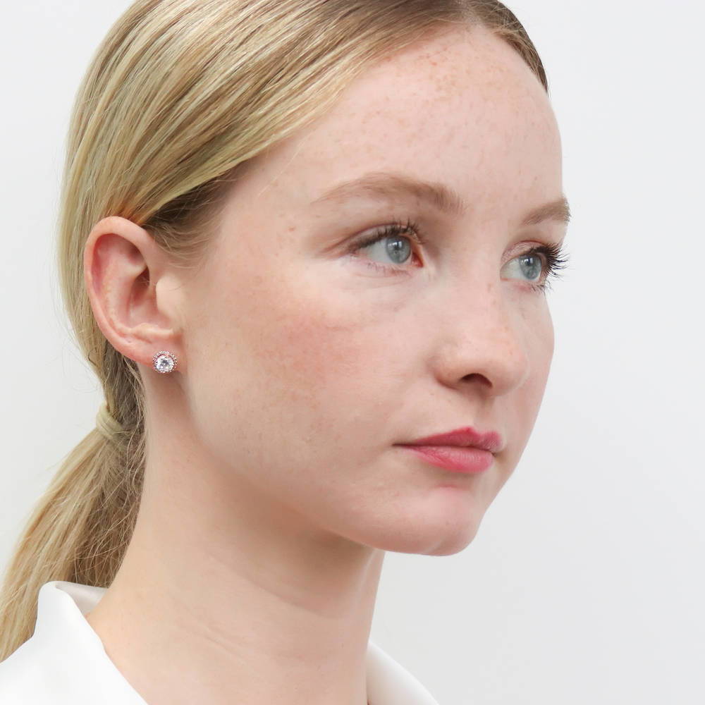 Model wearing Halo Round CZ Stud Earrings in Sterling Silver