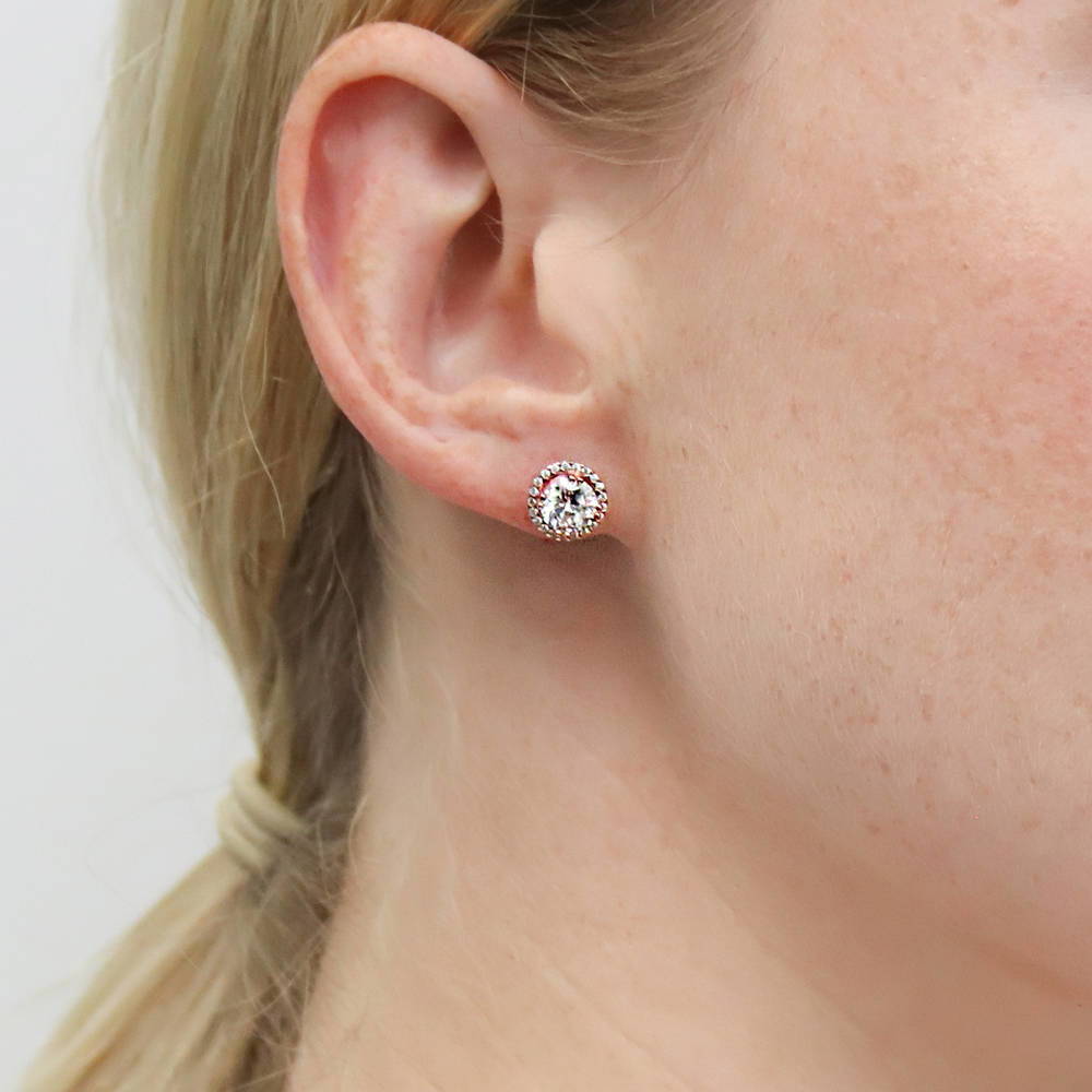 Model wearing Halo Round CZ Stud Earrings in Sterling Silver