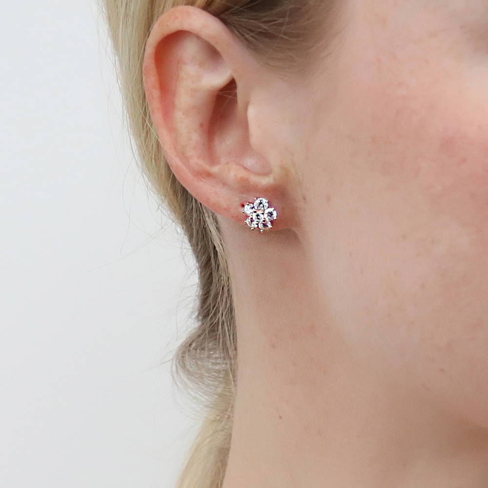 Model wearing Flower CZ Stud Earrings in Sterling Silver