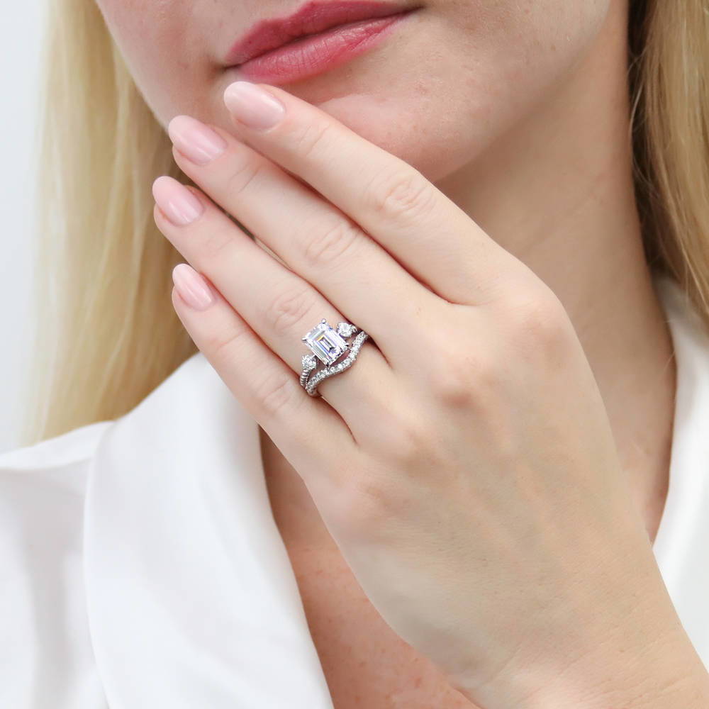 Model wearing 3-Stone Woven Emerald Cut CZ Ring Set in Sterling Silver