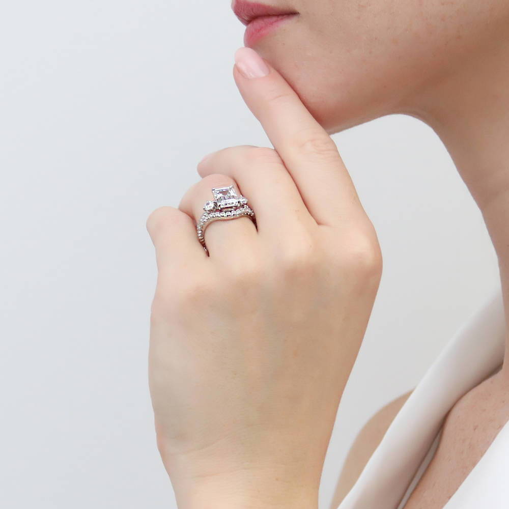 Model wearing 3-Stone Woven Emerald Cut CZ Ring Set in Sterling Silver