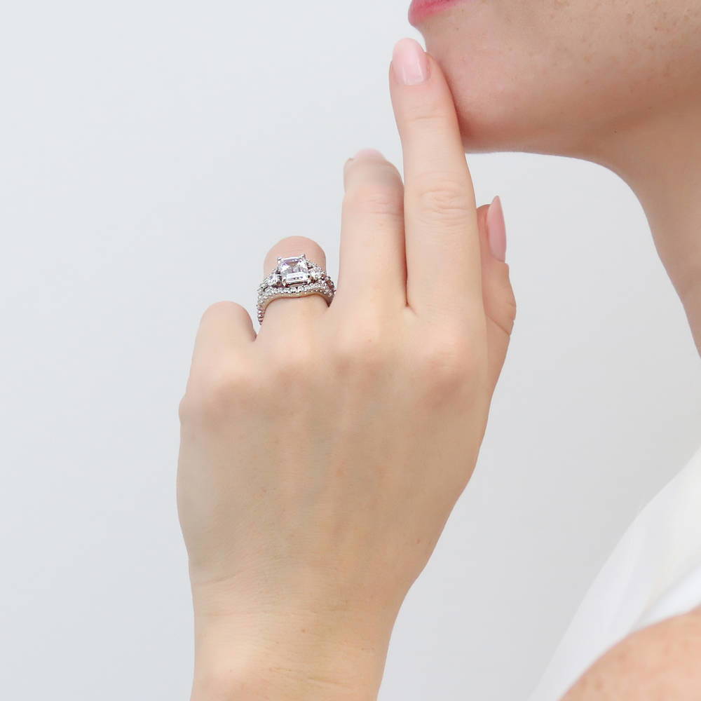 Model wearing 3-Stone Woven Emerald Cut CZ Ring Set in Sterling Silver