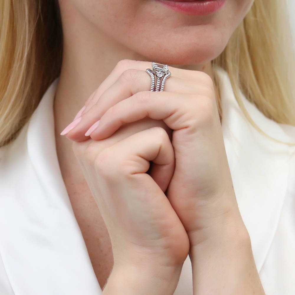 Model wearing 3-Stone Chevron Emerald Cut CZ Ring Set in Sterling Silver