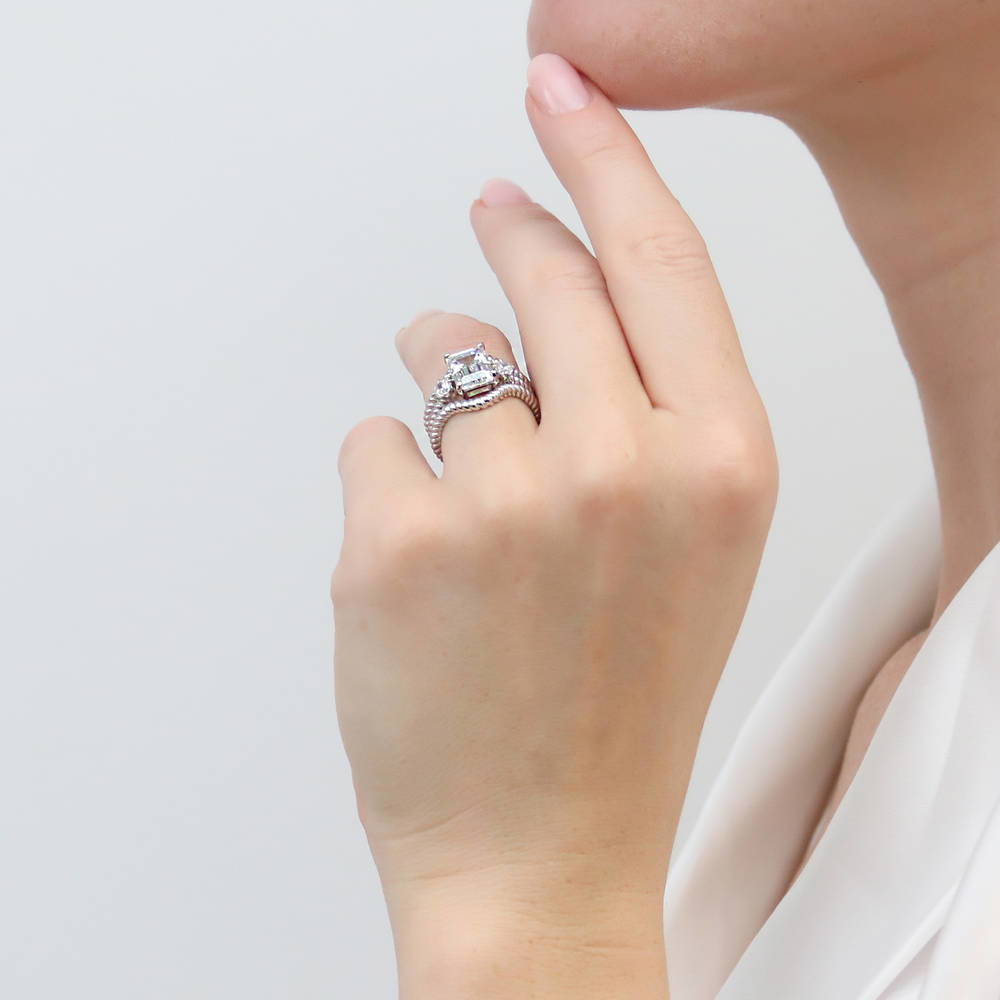 Model wearing 3-Stone Chevron Emerald Cut CZ Ring Set in Sterling Silver