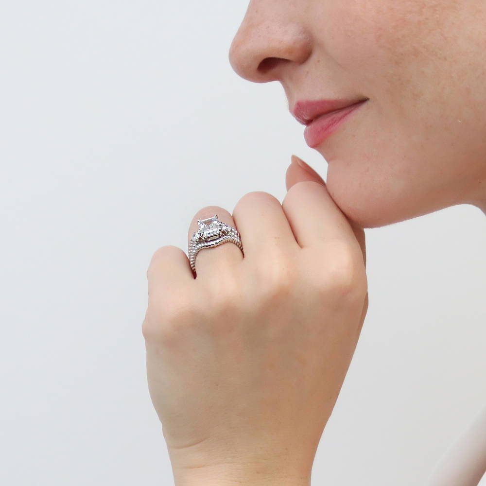 Model wearing 3-Stone Chevron Emerald Cut CZ Ring Set in Sterling Silver