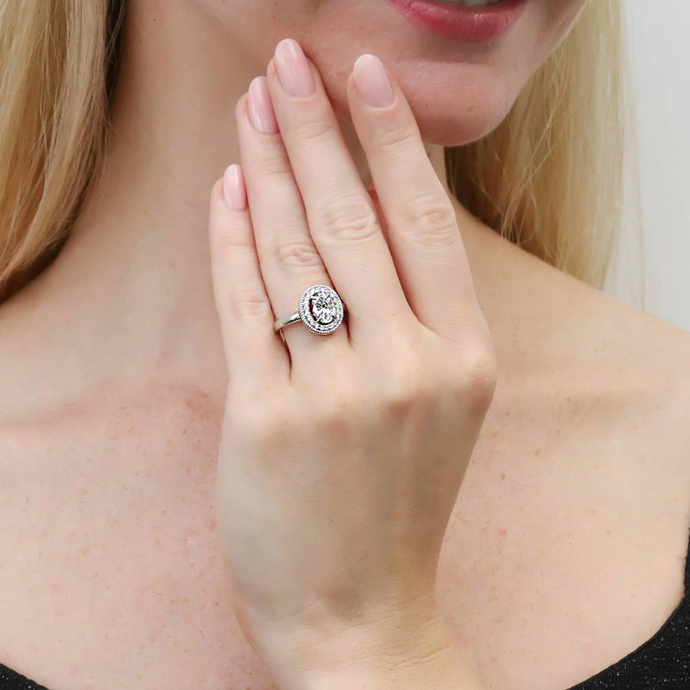 Model wearing Halo Woven Oval CZ Ring in Sterling Silver