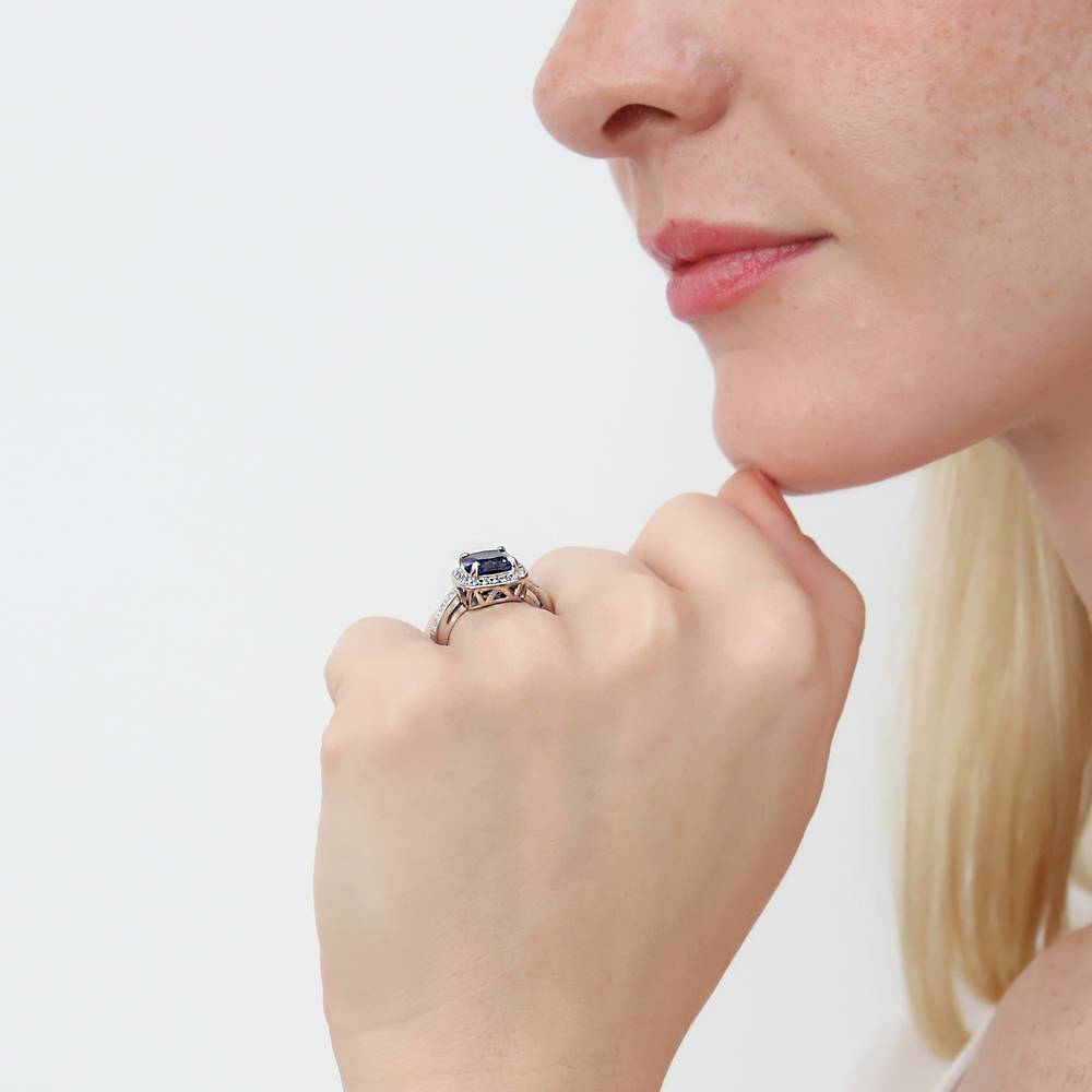 Model wearing Halo Simulated Blue Sapphire Cushion CZ Ring in Sterling Silver