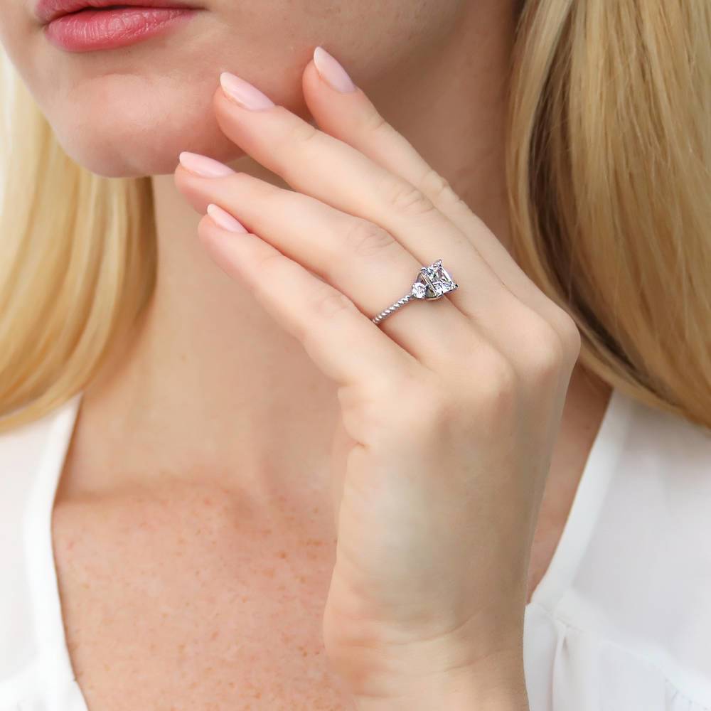 Model wearing 3-Stone Woven Princess CZ Ring Set in Sterling Silver
