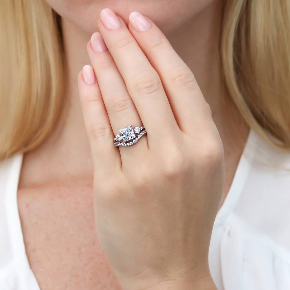 Model wearing 3-Stone Woven Princess CZ Ring Set in Sterling Silver