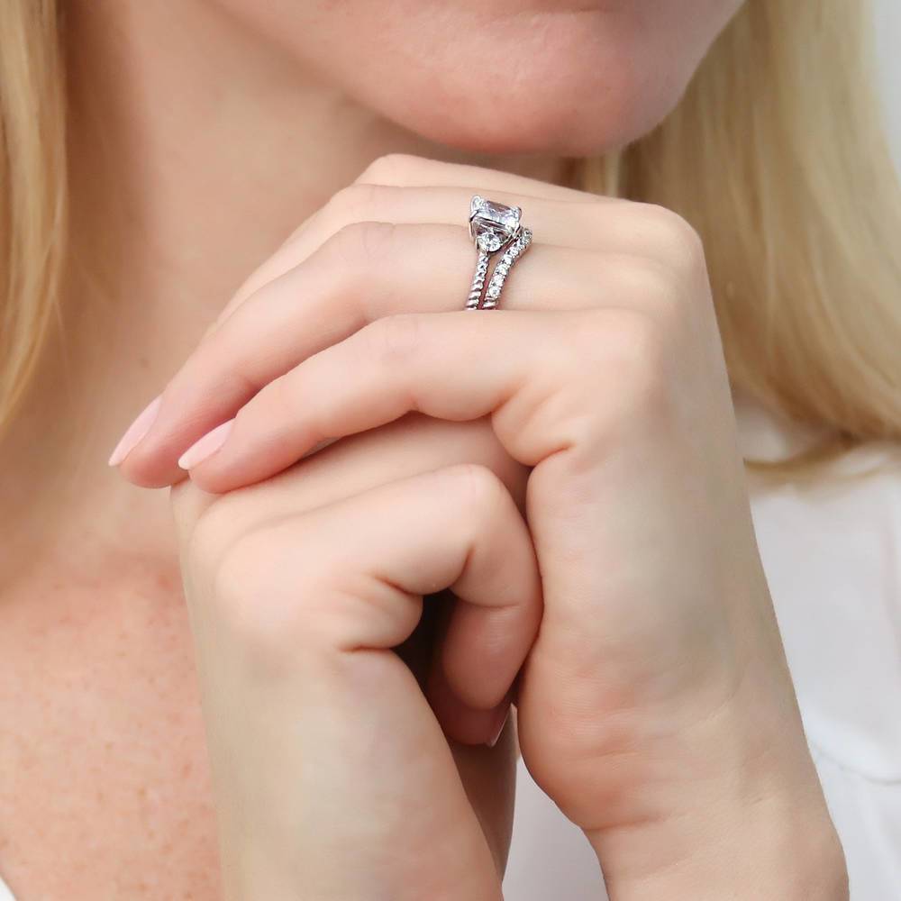 Model wearing 3-Stone Woven Princess CZ Ring Set in Sterling Silver