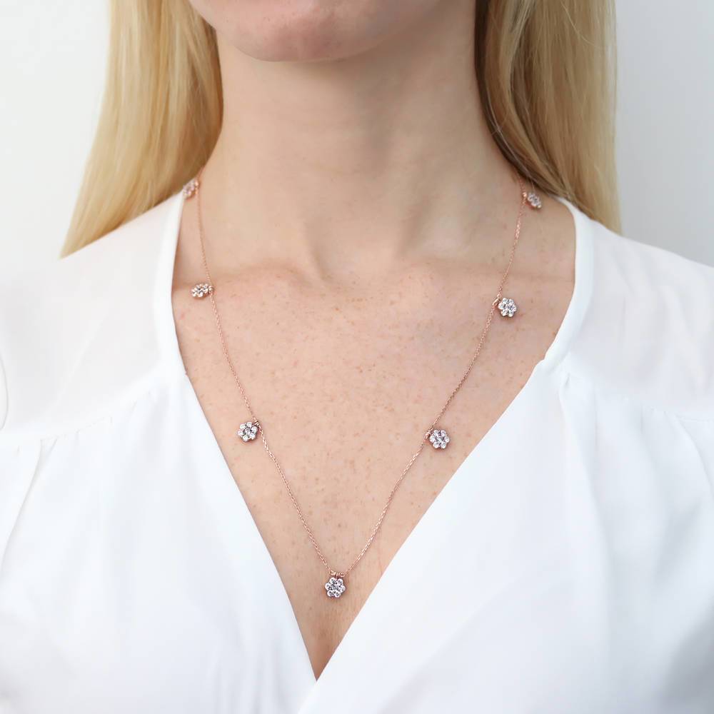 Model wearing Flower CZ Station Necklace in Rose Gold Flashed Sterling Silver