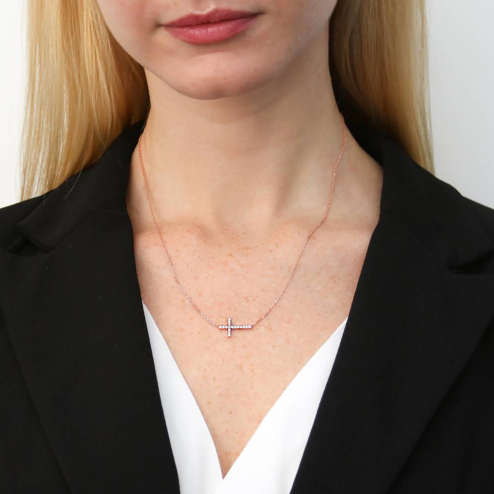 Model wearing Sideways Cross CZ Pendant Necklace in Rose Gold Flashed Sterling Silver