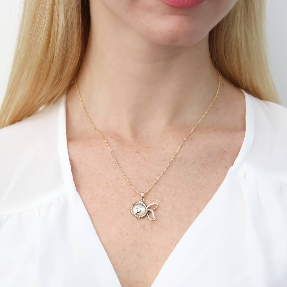 Model wearing Fish Mother Of Pearl Pendant Necklace in Gold Flashed Sterling Silver