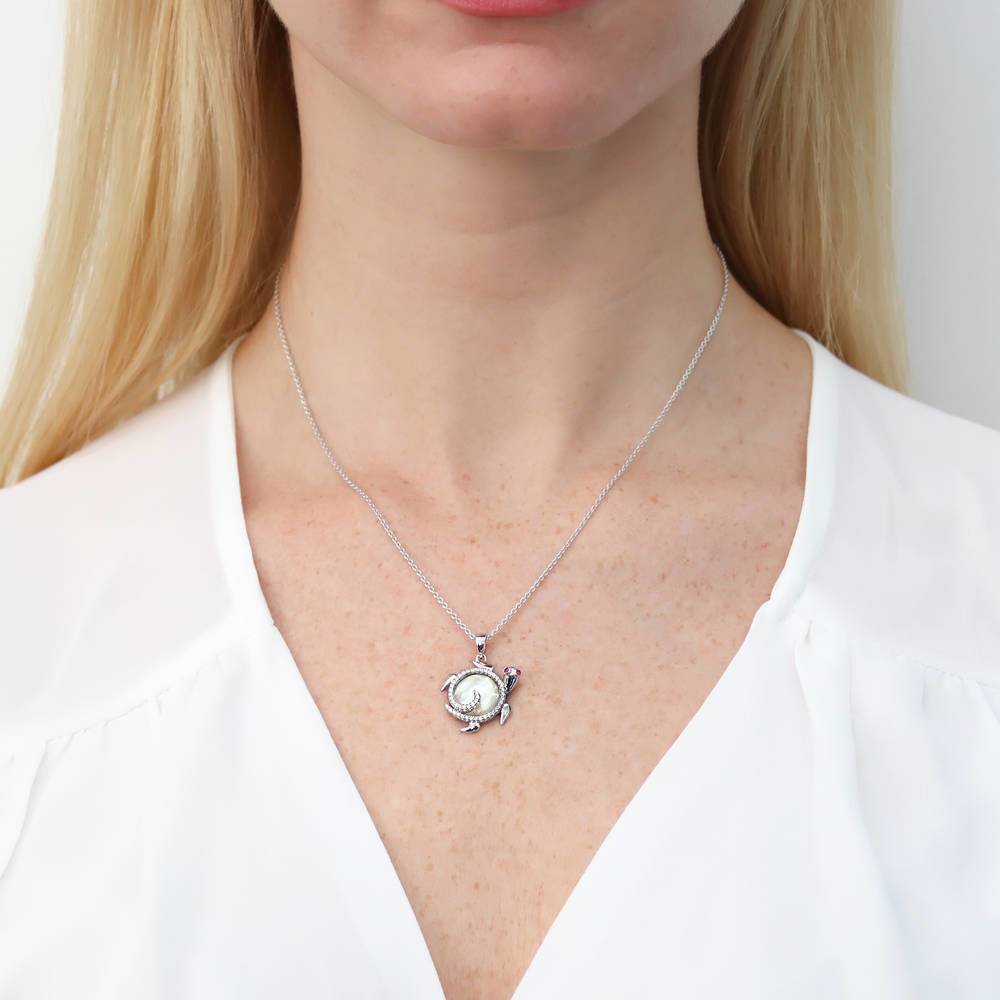 Model wearing Turtle Mother Of Pearl Pendant Necklace in Sterling Silver