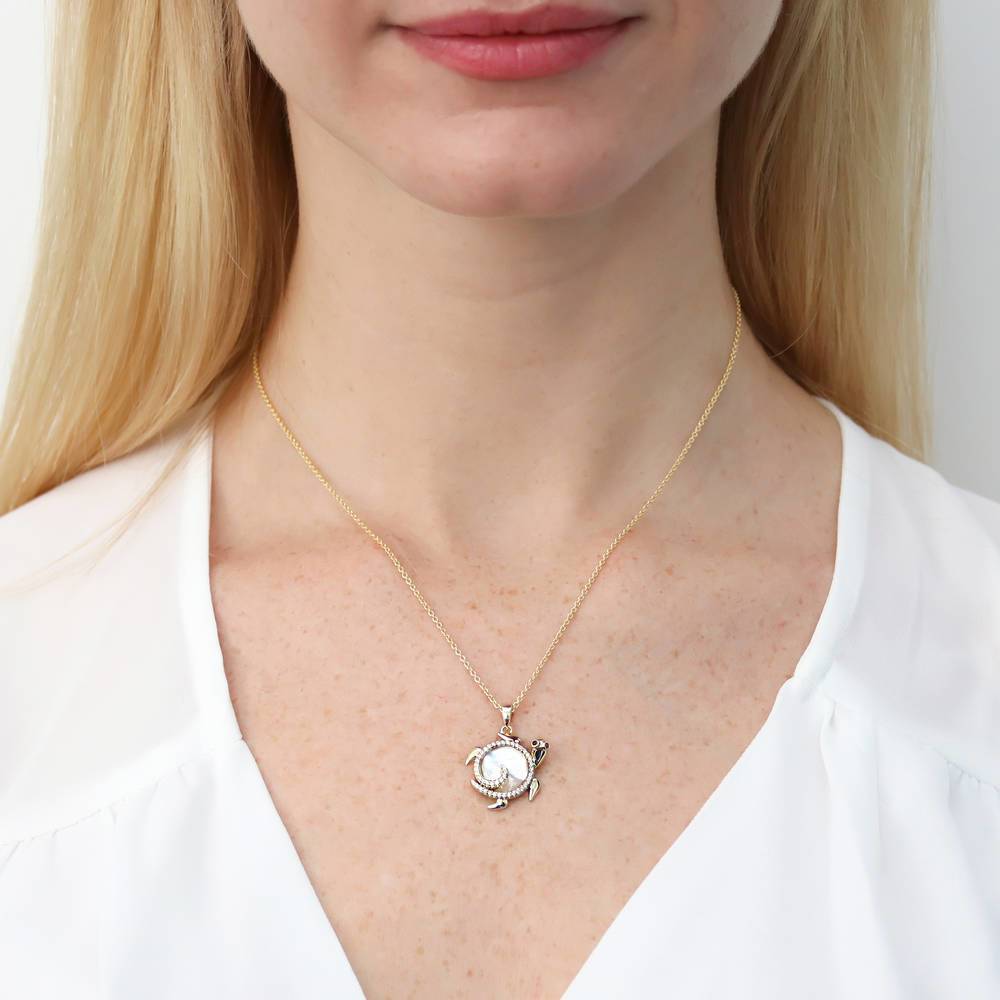 Model wearing Turtle Mother Of Pearl Pendant Necklace in Gold Flashed Sterling Silver