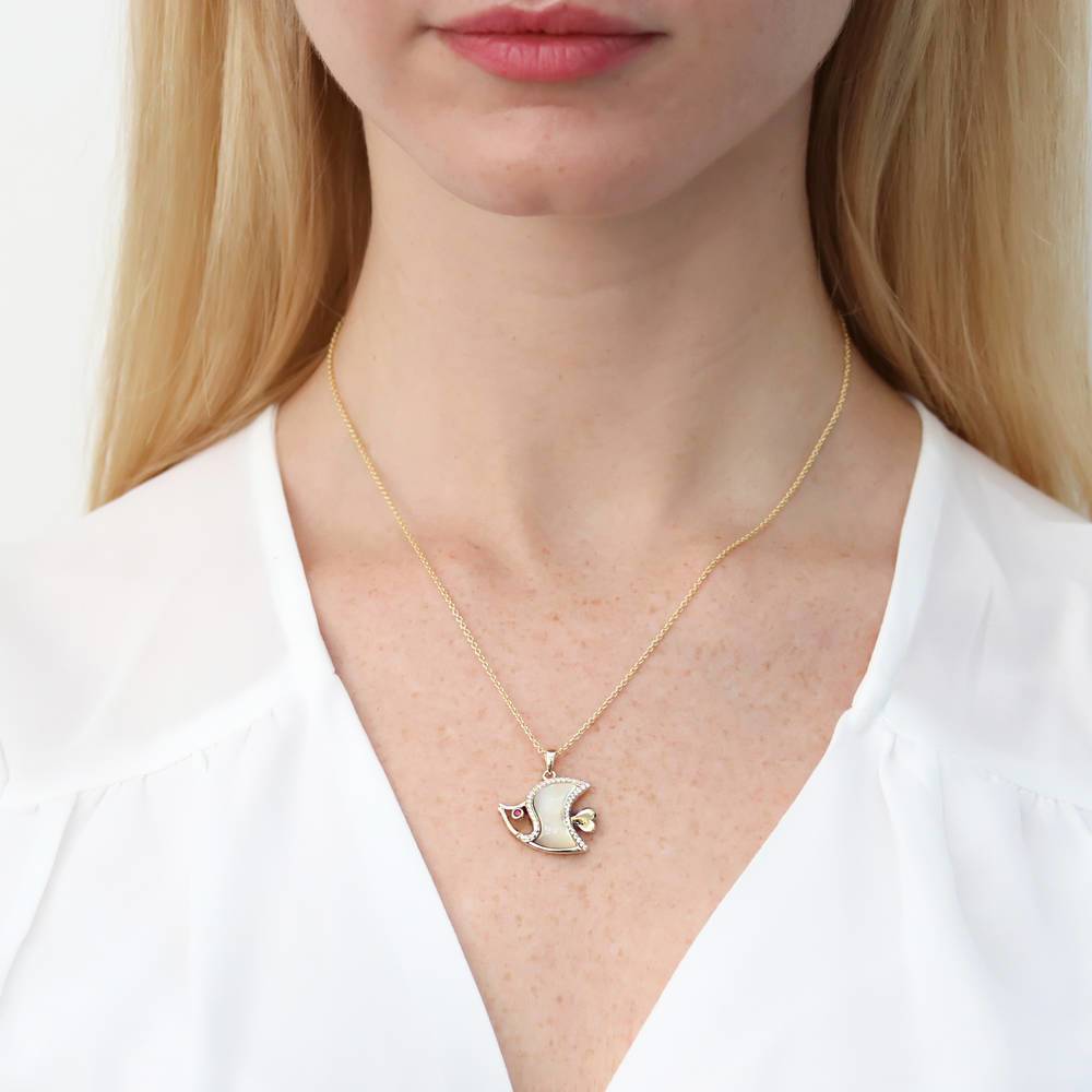 Model wearing Fish Mother Of Pearl Pendant Necklace in Gold Flashed Sterling Silver