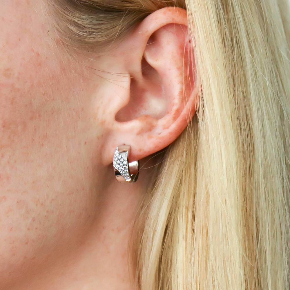 Model wearing Wave CZ Small Huggie Earrings in Sterling Silver 0.55 inch