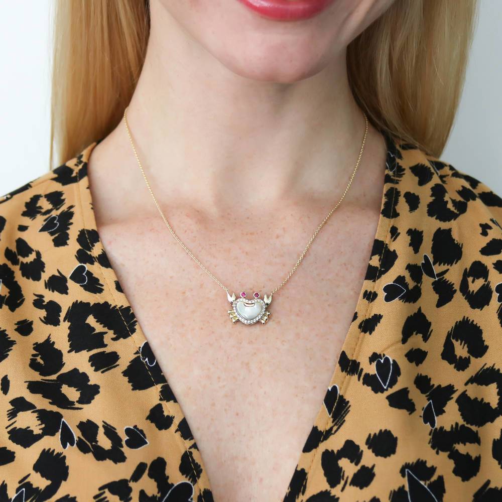 Model wearing Crab Mother Of Pearl Pendant Necklace in Gold Flashed Sterling Silver