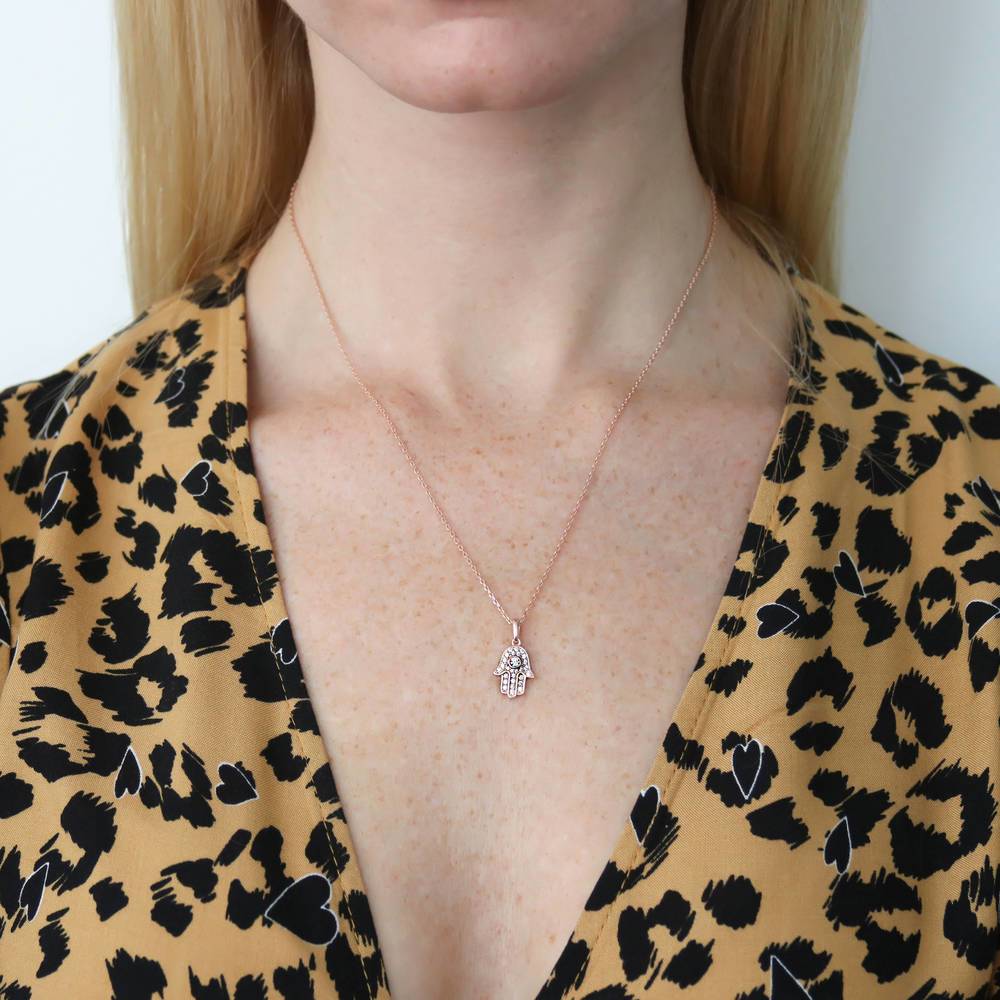 Model wearing Hamsa Hand CZ Pendant Necklace in Rose Gold Flashed Sterling Silver
