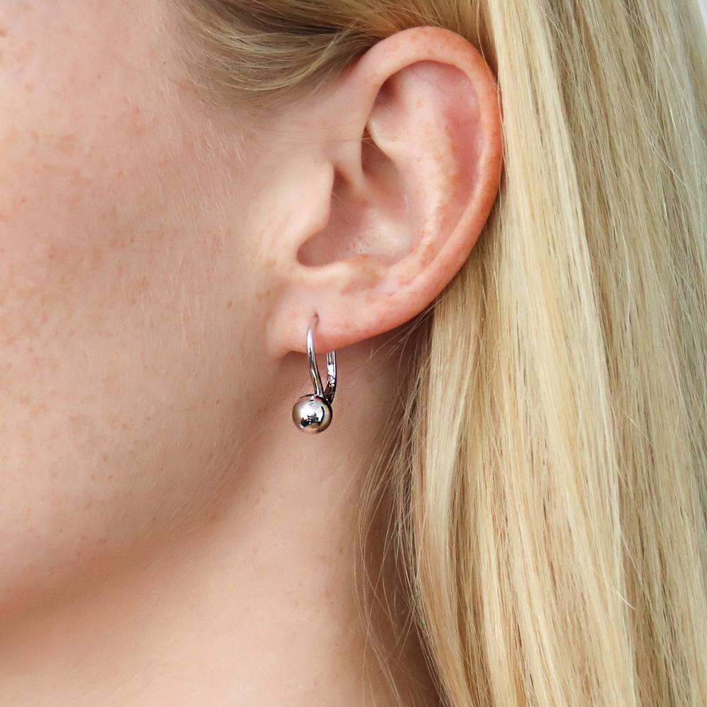 Model wearing Ball Bead Leverback Dangle Earrings in Sterling Silver