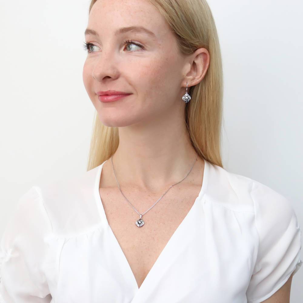 Model wearing Woven CZ Fish Hook Dangle Earrings in Sterling Silver