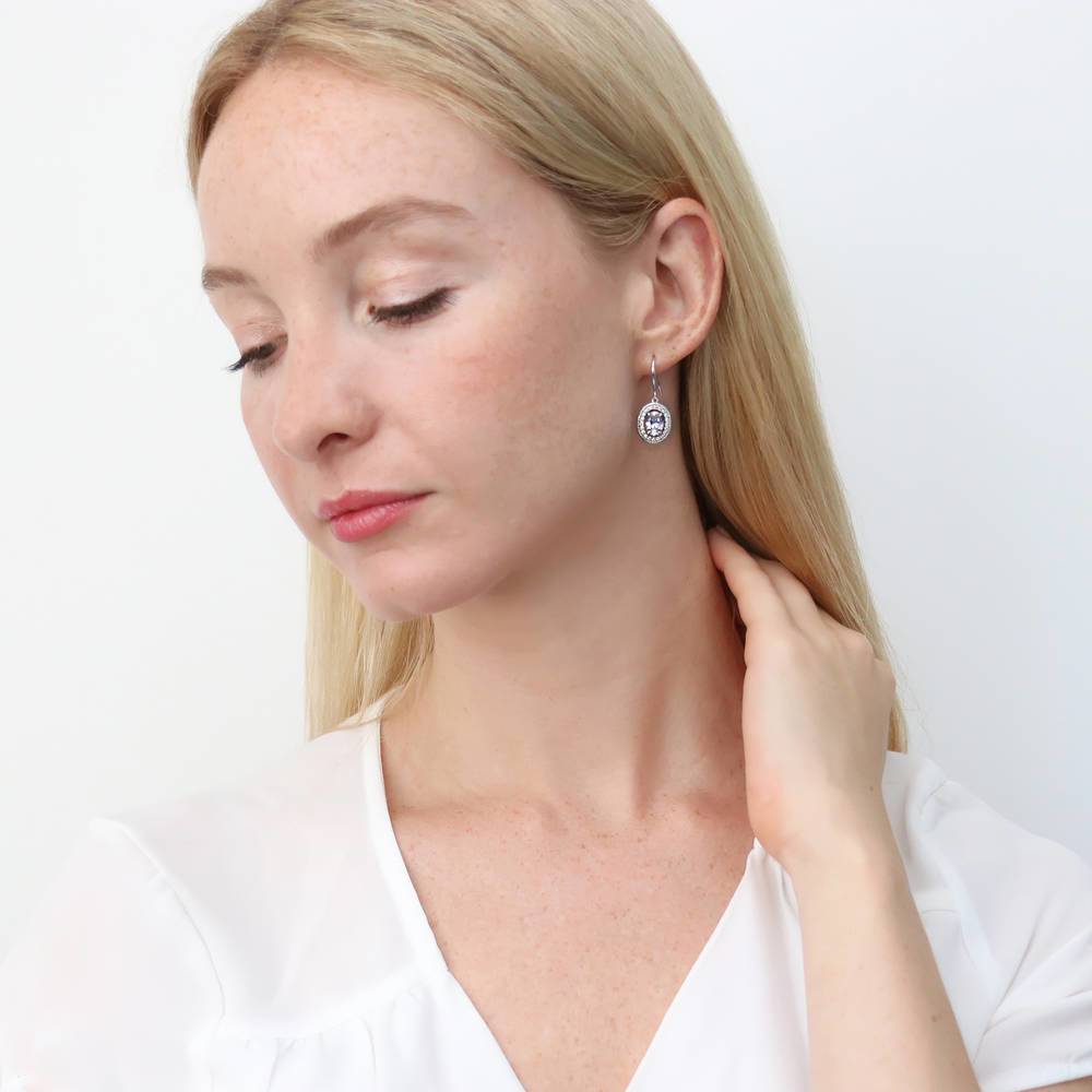 Model wearing Halo Woven Oval CZ Fish Hook Dangle Earrings in Sterling Silver