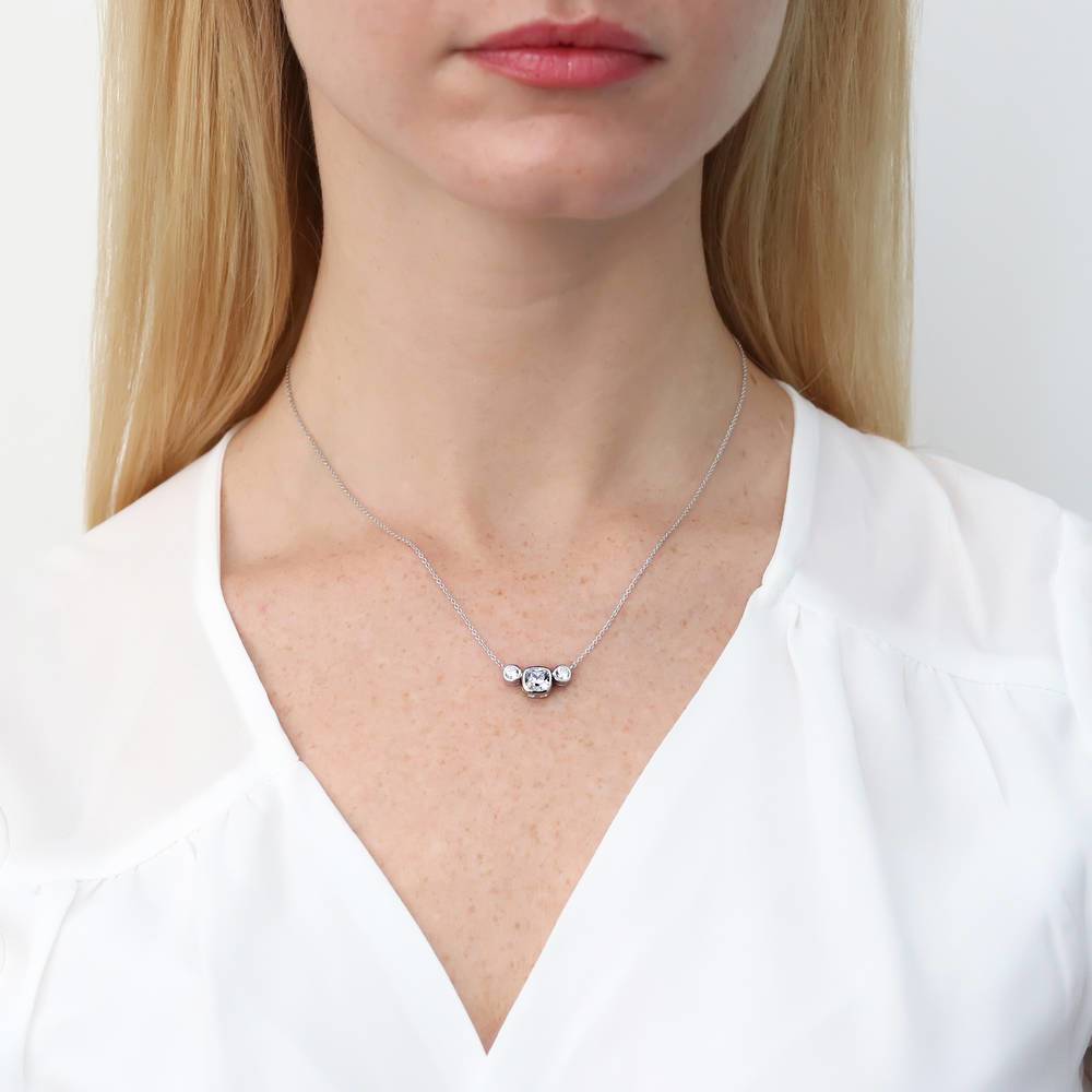 Model wearing 3-Stone Cushion CZ Pendant Necklace in Sterling Silver, 2 of 7
