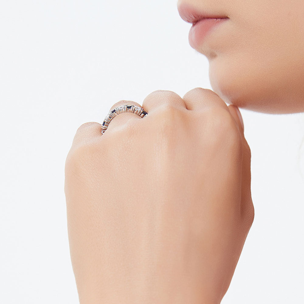 Model wearing Simulated Blue Sapphire CZ Eternity Ring in Sterling Silver
