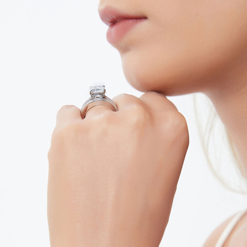 Model wearing Solitaire 3.8ct Emerald Cut CZ Statement Ring Set in Sterling Silver