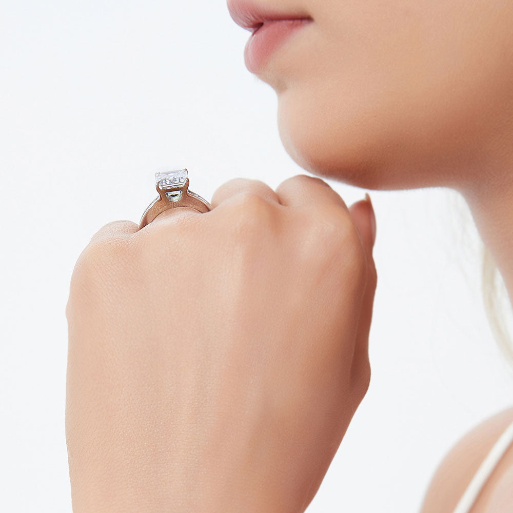 Model wearing Solitaire 3.8ct Emerald Cut CZ Ring in Sterling Silver