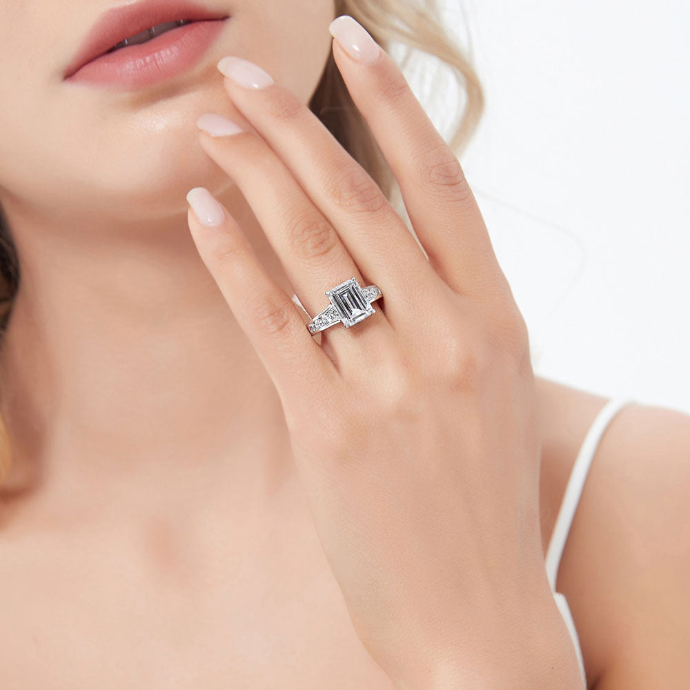 Model wearing Solitaire 3.8ct Emerald Cut CZ Ring in Sterling Silver