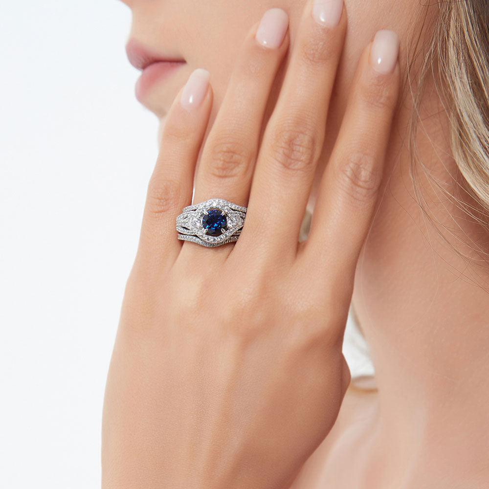Model wearing 3-Stone Simulated Blue Sapphire Round CZ Ring Set in Sterling Silver