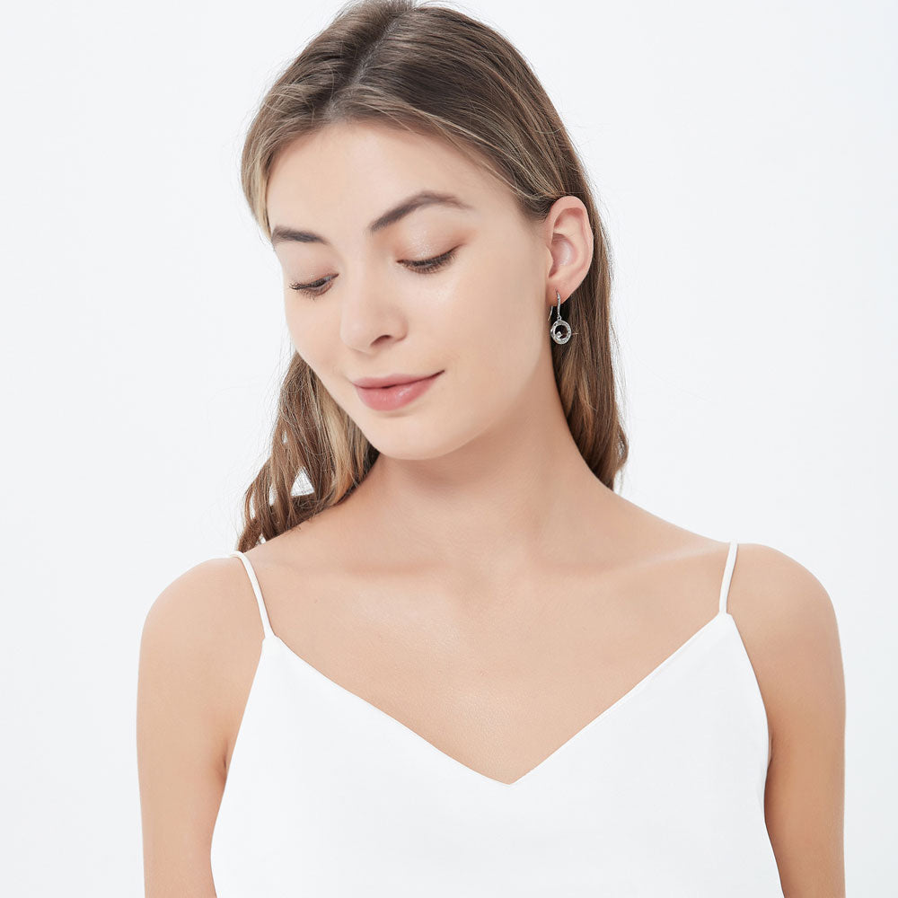 Model wearing Open Circle Woven CZ Fish Hook Dangle Earrings in Sterling Silver