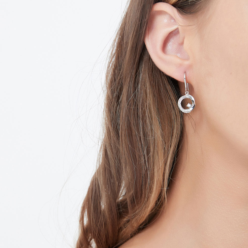 Model wearing Open Circle Woven CZ Fish Hook Dangle Earrings in Sterling Silver