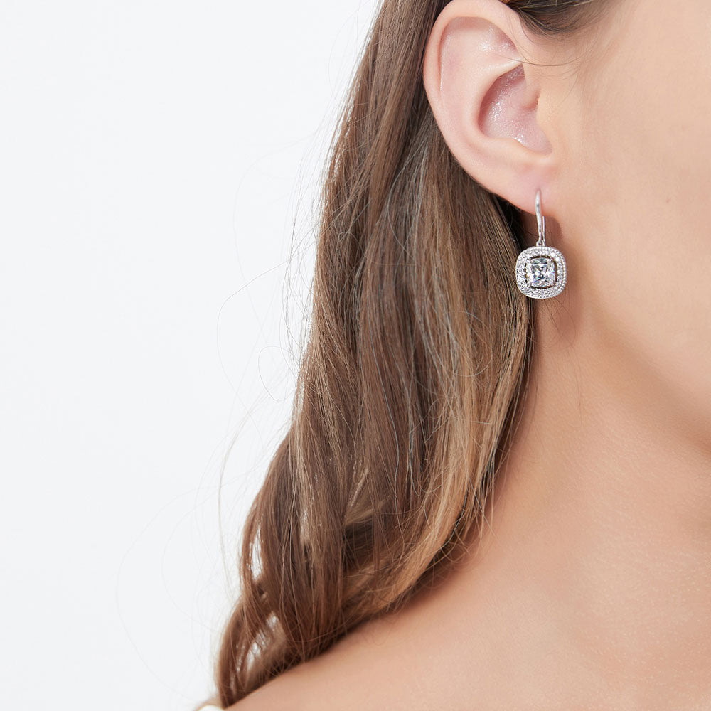 Model wearing Halo Woven Cushion CZ Fish Hook Dangle Earrings in Sterling Silver