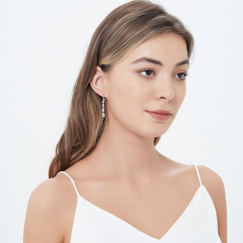 Model wearing Graduated CZ Leverback Dangle Earrings in Sterling Silver