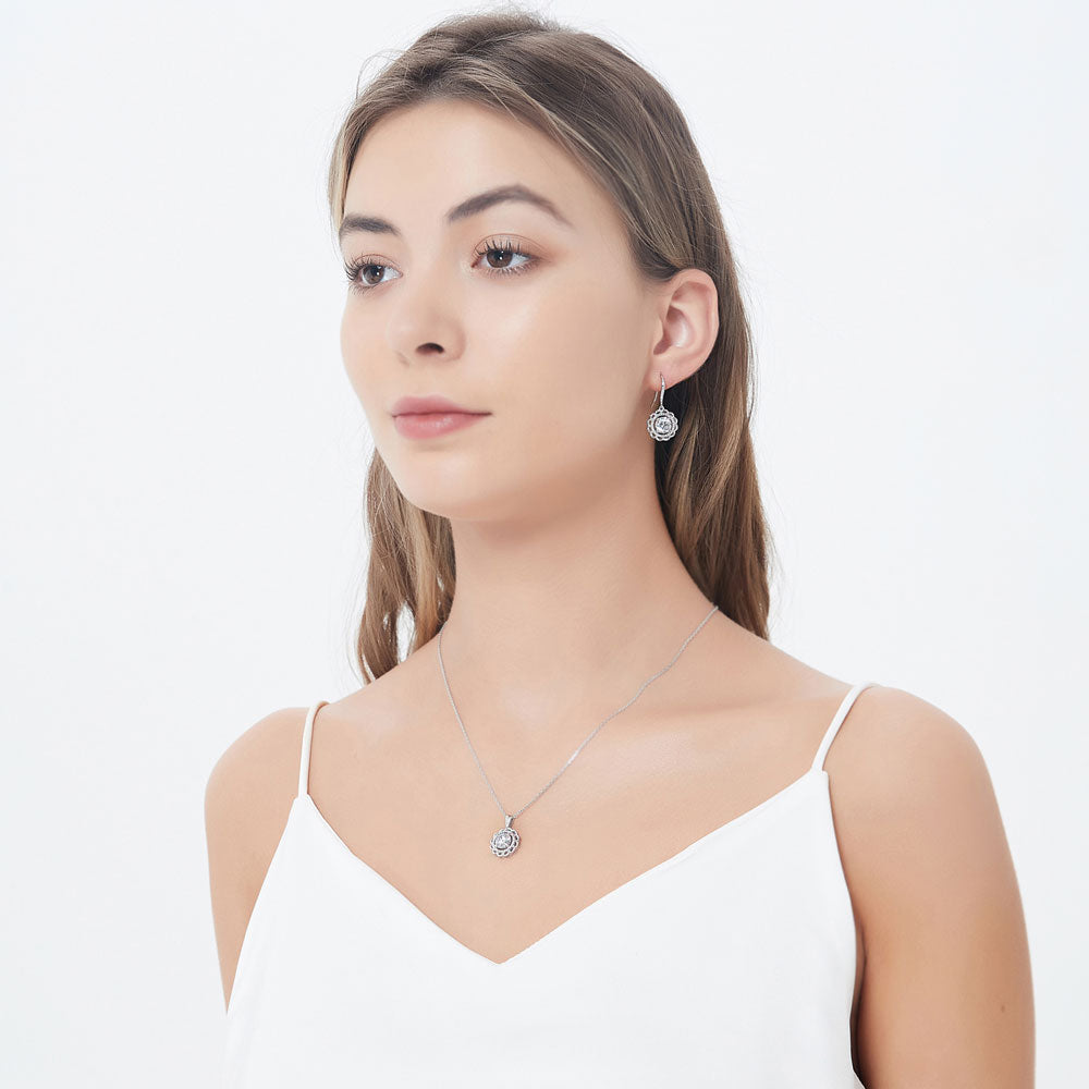 Model wearing Flower Solitaire CZ Necklace and Earrings Set in Sterling Silver