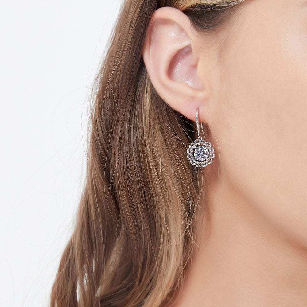 Model wearing Solitaire Woven 2.5ct Round CZ Fish Hook Earrings in Sterling Silver