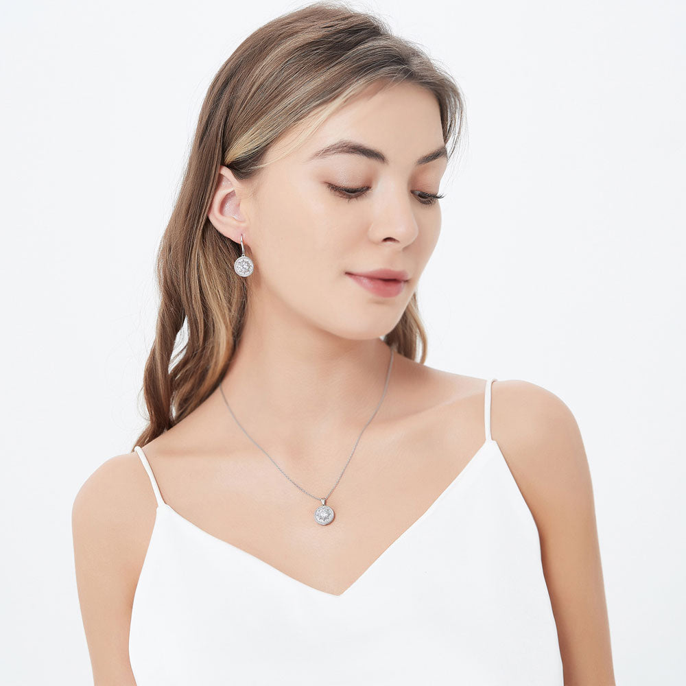 Model wearing Cable Halo CZ Fish Hook Dangle Earrings in Sterling Silver