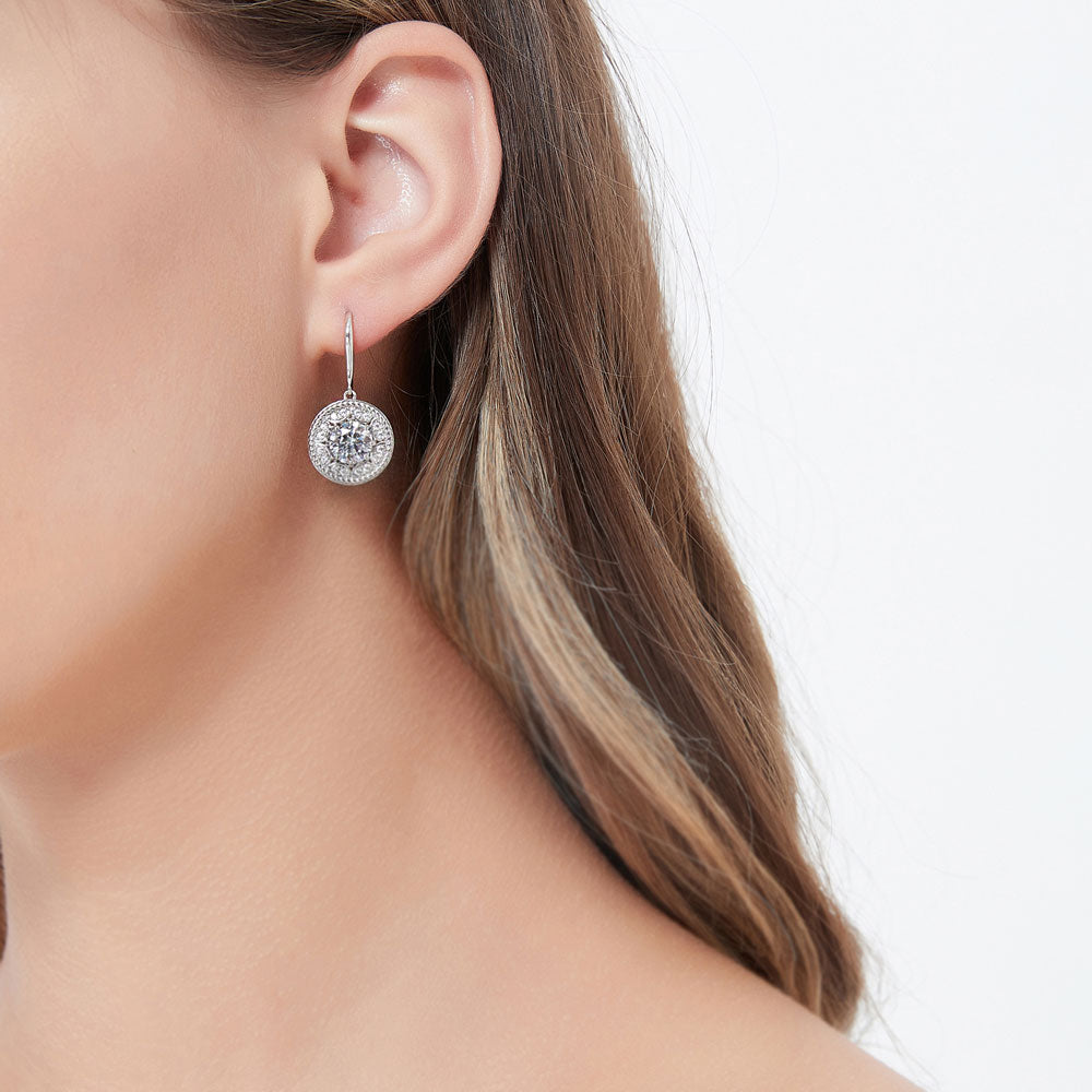 Model wearing Cable Halo CZ Fish Hook Dangle Earrings in Sterling Silver